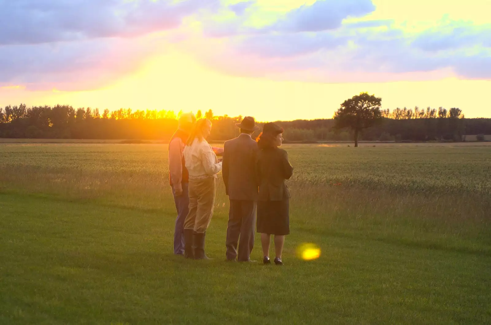 A 1940s crowd watches the sunset, from Maurice's Mustang Hangar Dance, Hardwick Airfield, Norfolk - 16th July 2011