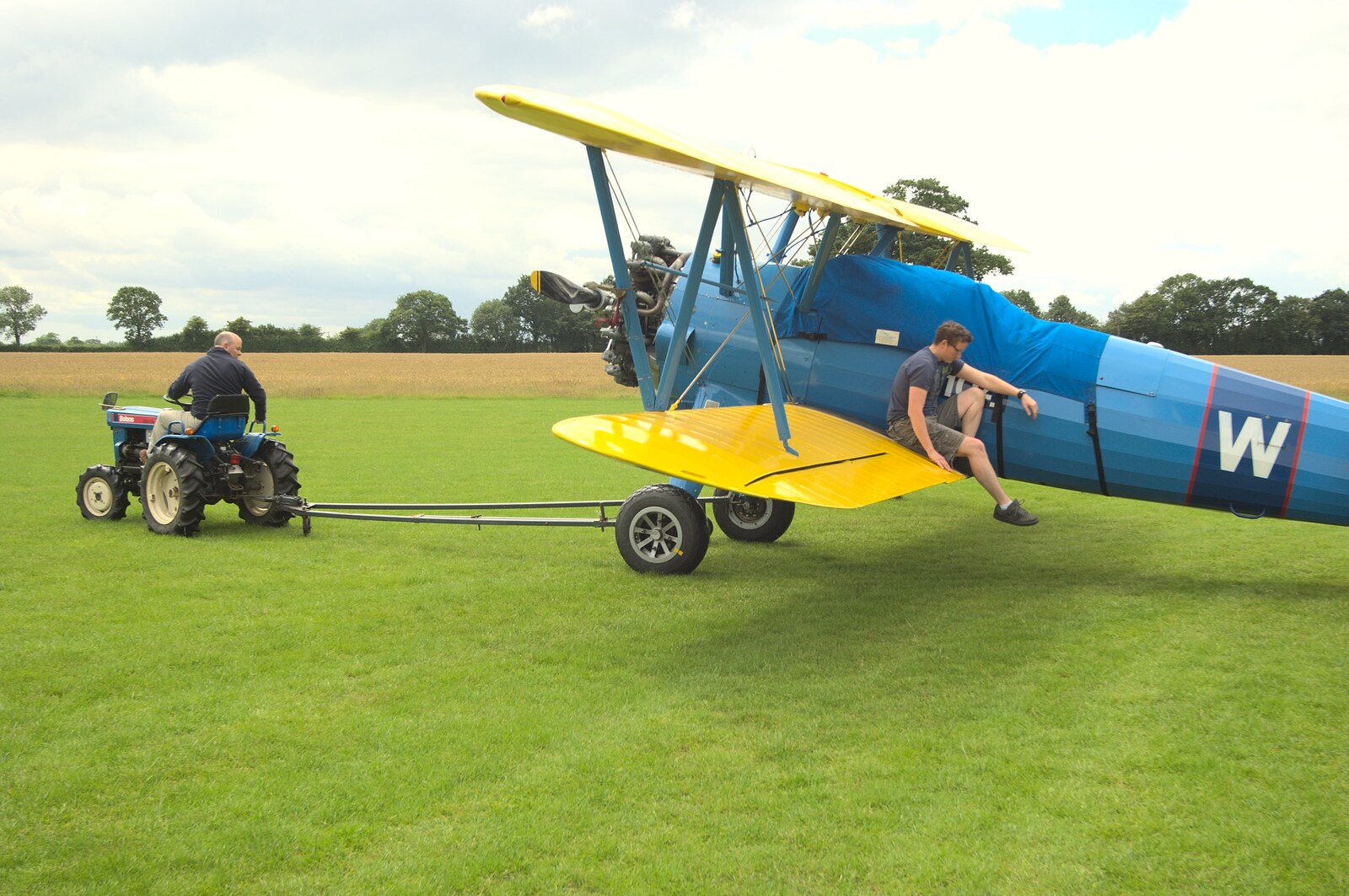 The Stearman is towed around from Maurice's Mustang Hangar Dance, Hardwick Airfield, Norfolk - 16th July 2011