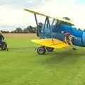 The Stearman is towed around, Maurice's Mustang Hangar Dance, Hardwick Airfield, Norfolk - 16th July 2011