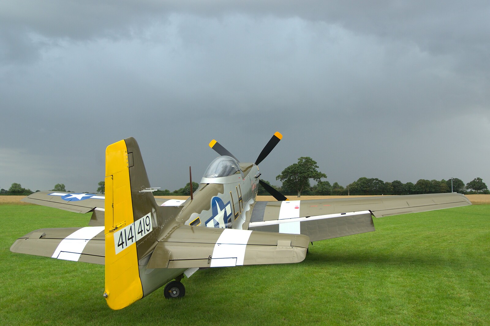 Janie watches the approching storm from Nosher Flies in a P-51D Mustang, Hardwick Airfield, Norfolk (and the Whole of Suffolk) - 17th July 2011