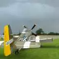 Janie watches the approching storm, Nosher Flies in a P-51D Mustang, Hardwick Airfield, Norfolk (and the Whole of Suffolk) - 17th July 2011