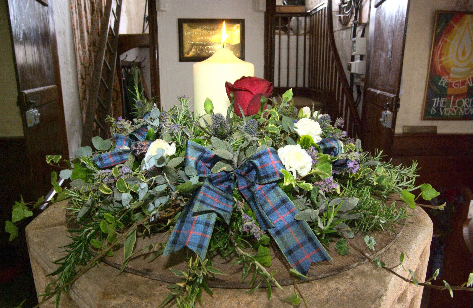 In the church, a candle and a tartan scene from Rob and Wilma's Wedding, Thornham and Thrandeston, Suffolk - 6th August 2011