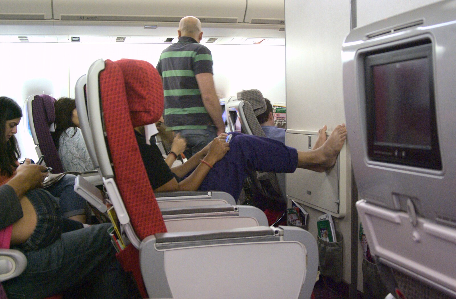 Somebody kicks back on the plane from Phil and Tania's Wedding, Short Hills, New Jersey, USA - 20th August 2011