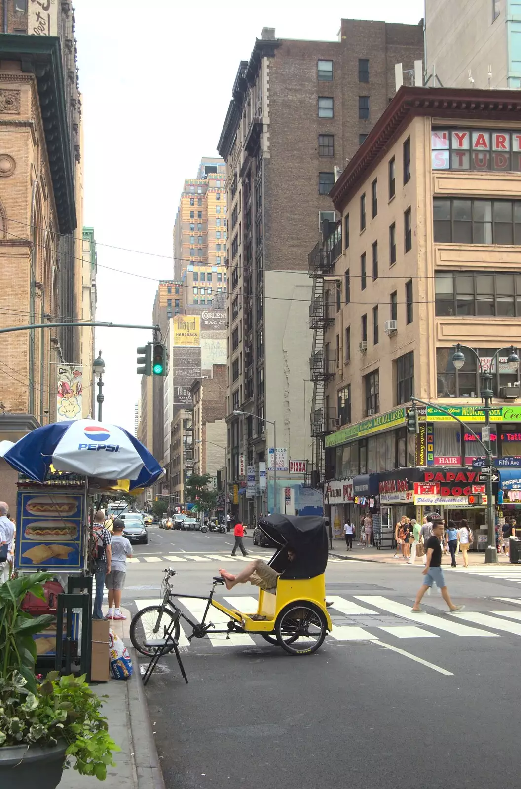 A rickshaw takes a break by a hot dog stand, from A Manhattan Hotdog, New York, USA - 21st August 2011