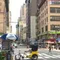 A rickshaw takes a break by a hot dog stand, A Manhattan Hotdog, New York, USA - 21st August 2011