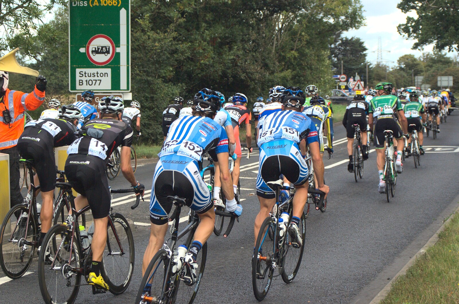 The big group heads up the A140 towards Diss from The Tour of Britain, Brome, Suffolk - 17th September 2011