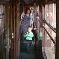 Isobel follows Zack on the train, The 1940s Steam Train Weekend, Holt, Norfolk - 18th September 2011