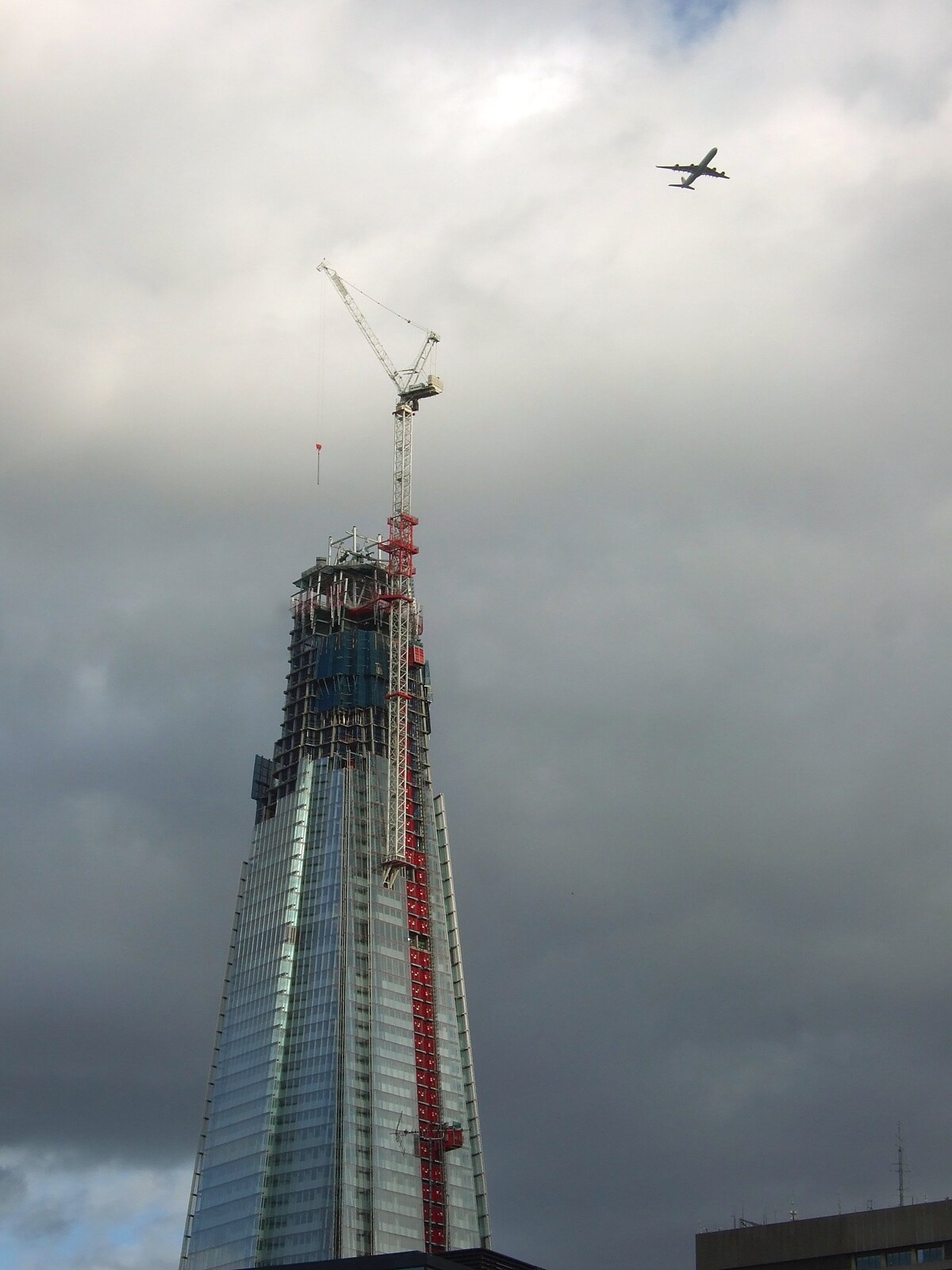 A plane flies over The Shard on a rainy day from TouchType Moves Offices and a Night in The Kings Head, Brockdish and London - 19th October 2011