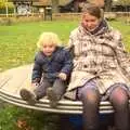 Fred and Isobel spin round, Autumn in Thornham Estate, Thornham, Suffolk - 6th November 2011