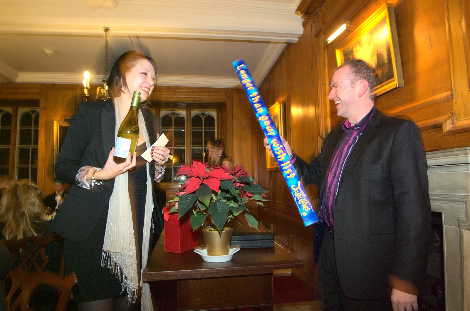 James waves a round a giant packet of Jaffa Cakes from A Qualcomm Christmas, Christ's College, Cambridge - 8th December 2011