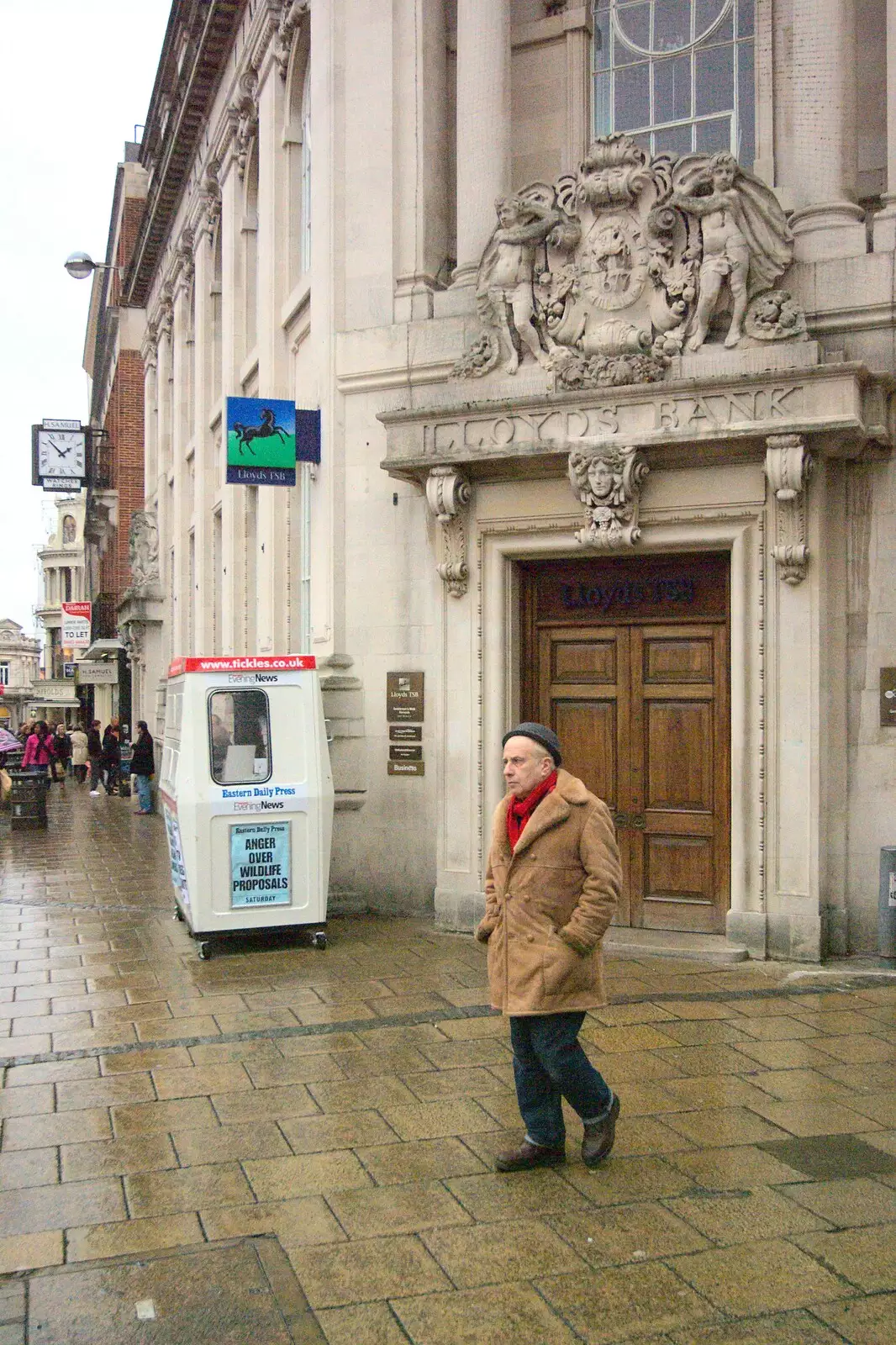 Some dude roams around outside Lloyds Bank, from Amandines, The BBs at the Park Hotel, and Norwich, Norfolk - 10th December 2011