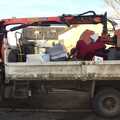 2012 A van hauls away a load of ancient CRT TVs