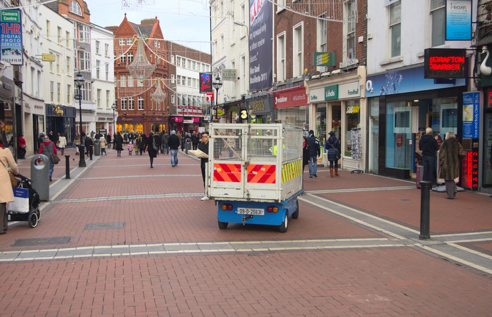 A Day in Dublin, Ireland - 7th January 2012: A little council truck roams around Grafton Street