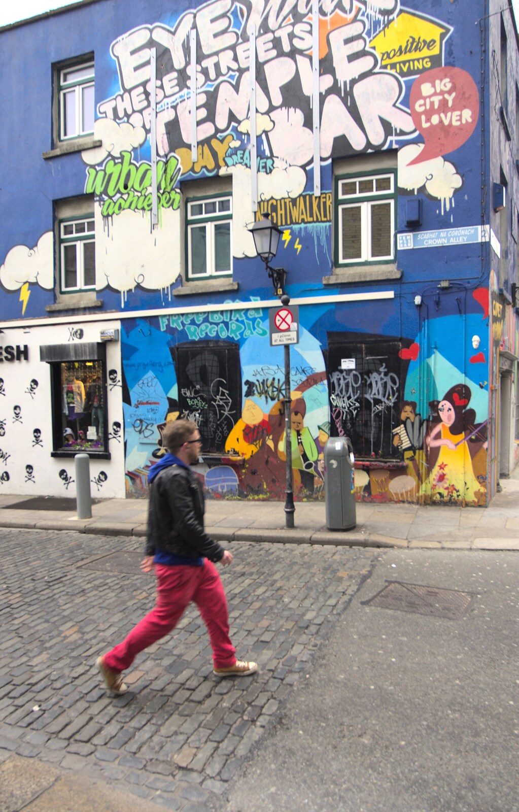 A Day in Dublin, Ireland - 7th January 2012: A dude walks past a painted building in Temple Bar