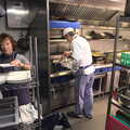 Wayne stirs whilst Caro's mum prepares crockery, Nom Nom's Popup Restaurant, Dublin, Ireland - 7th January 2012