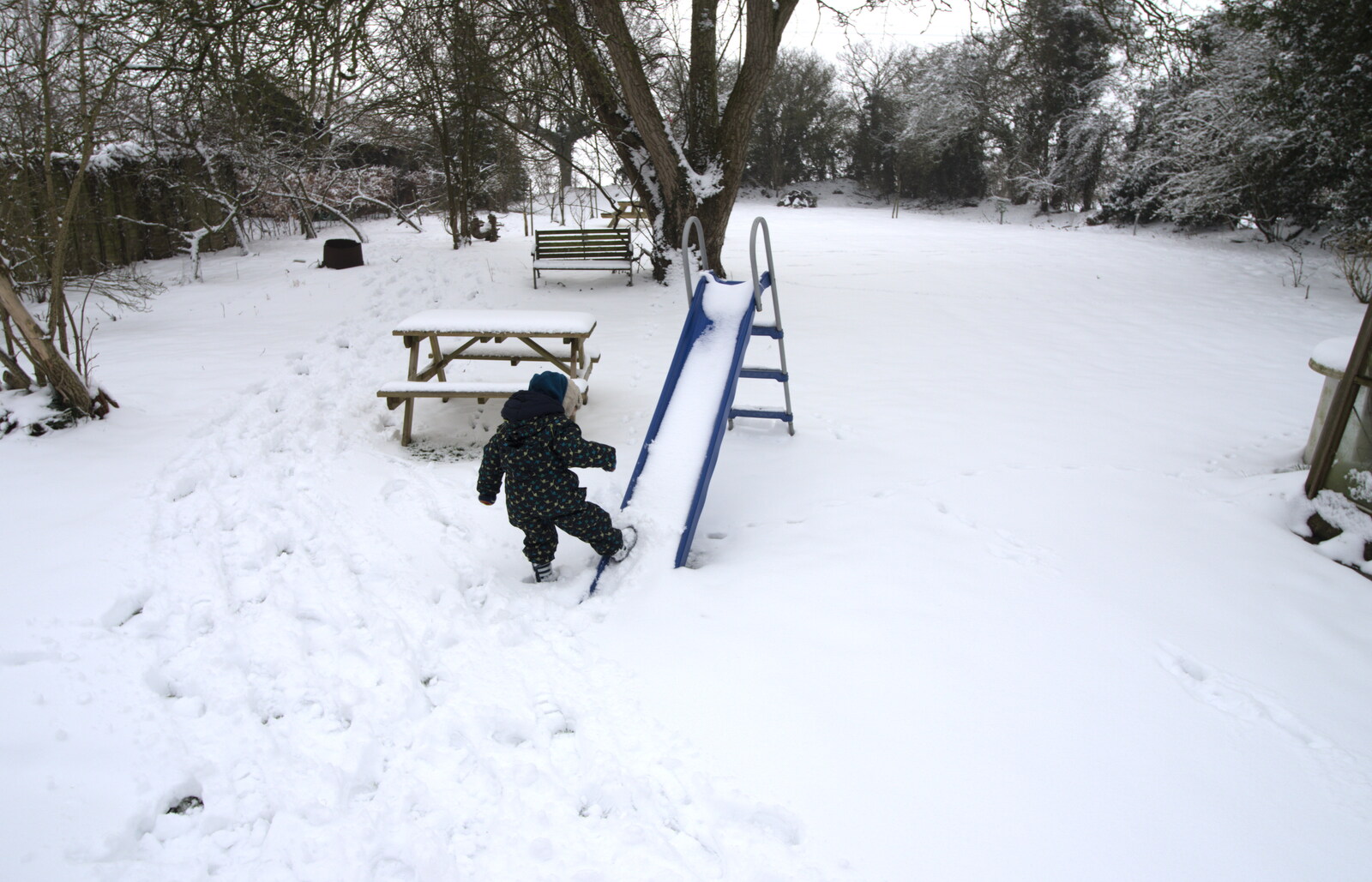 Fred kicks snow up a slide from A Snowy February Miscellany, Suffolk - 7th February 2012