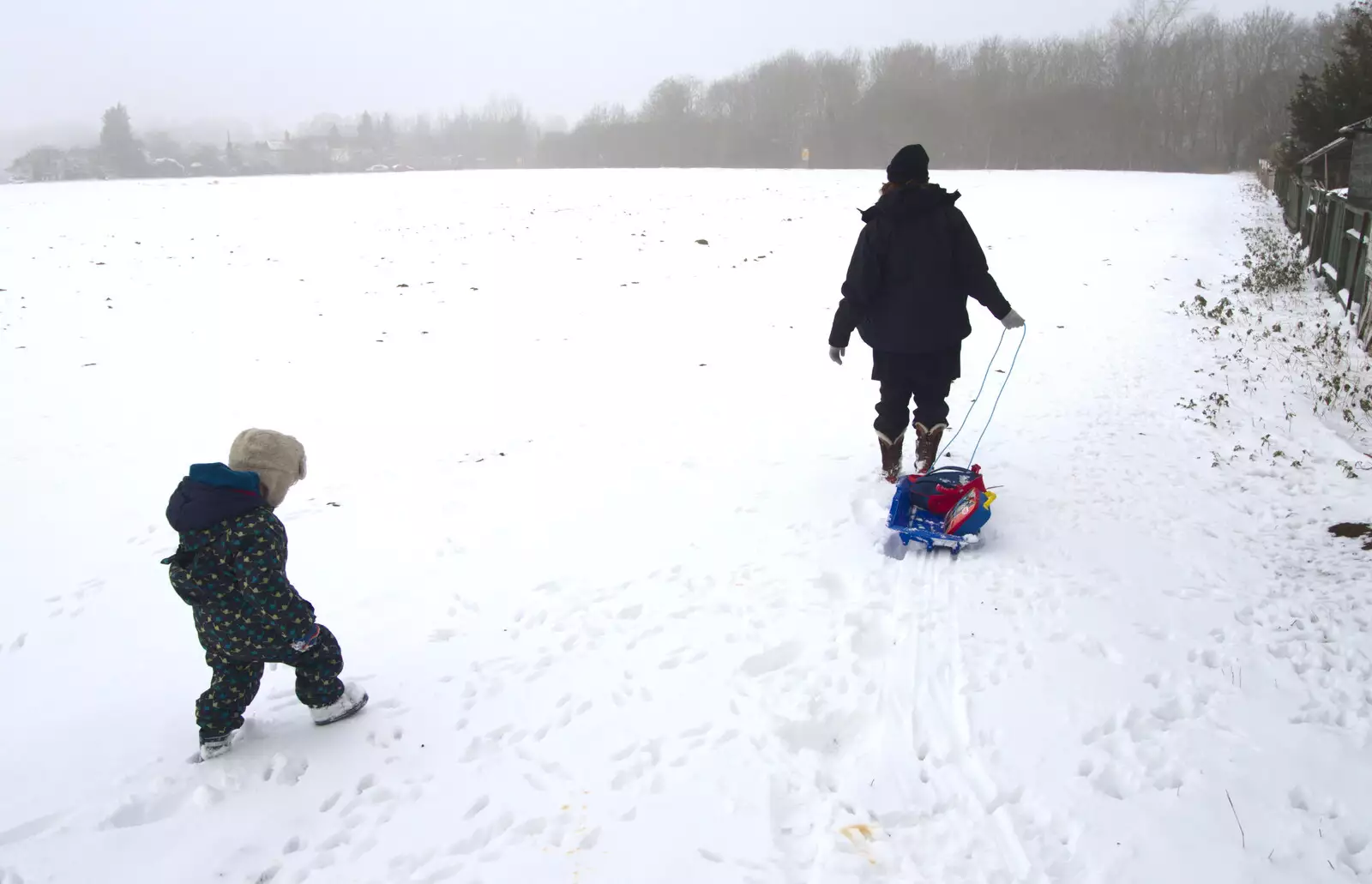 Fred and Isobel venture off across the side field, from A Snowy February Miscellany, Suffolk - 7th February 2012