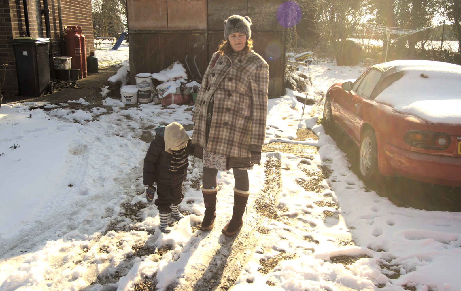 Fred and Isobel in front of the asbestos garage from A Snowy February Miscellany, Suffolk - 7th February 2012