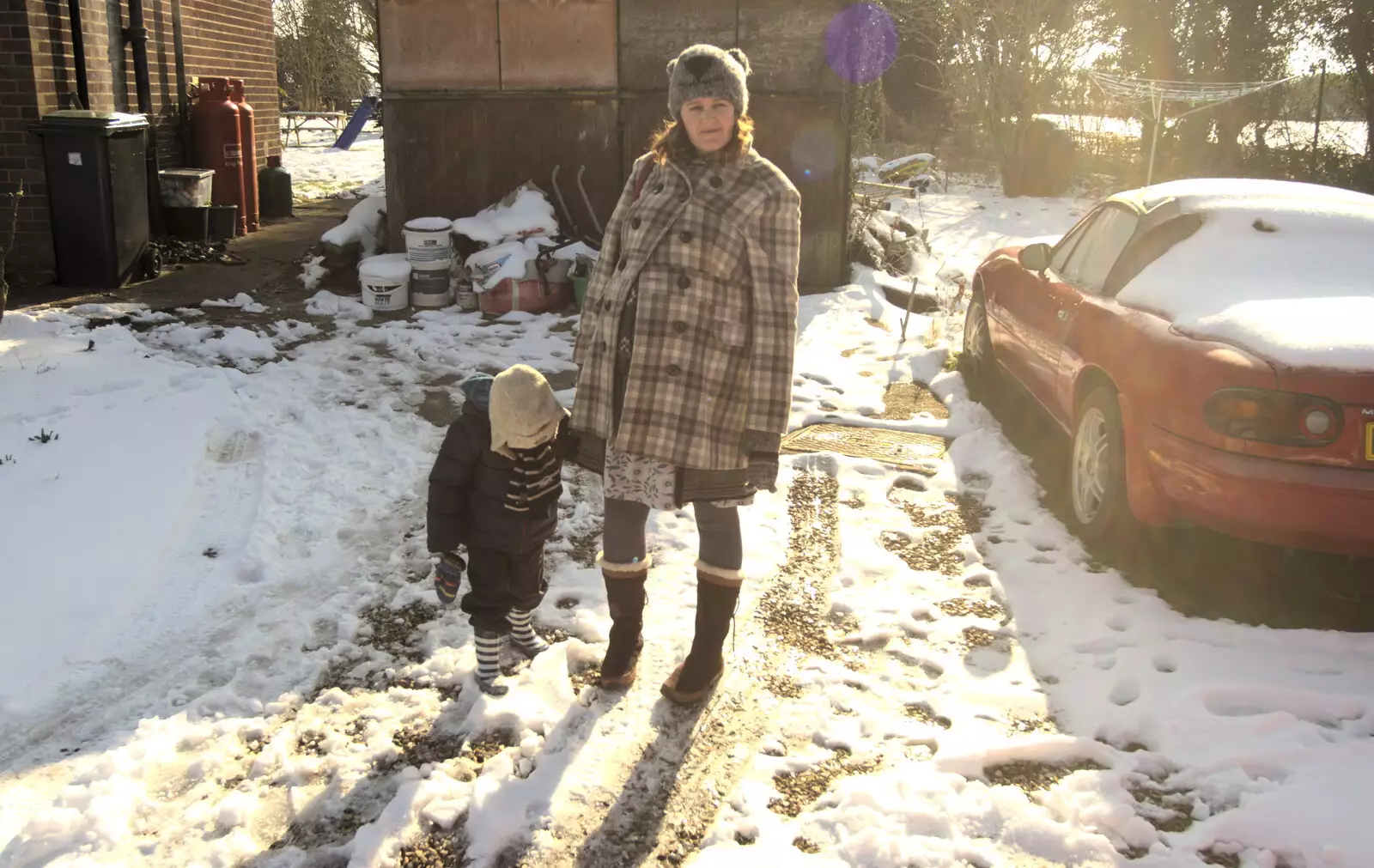 Fred and Isobel in front of the asbestos garage, from A Snowy February Miscellany, Suffolk - 7th February 2012