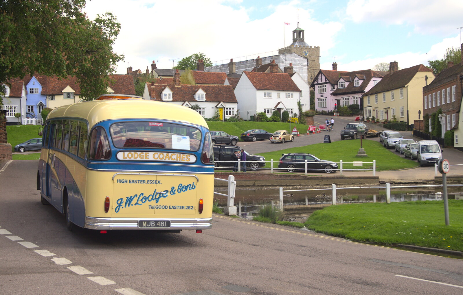 The coach trundles off through Finchingfield from The BSCC Cycling Weekend, The Swan Inn, Thaxted, Essex - 12th May 2012