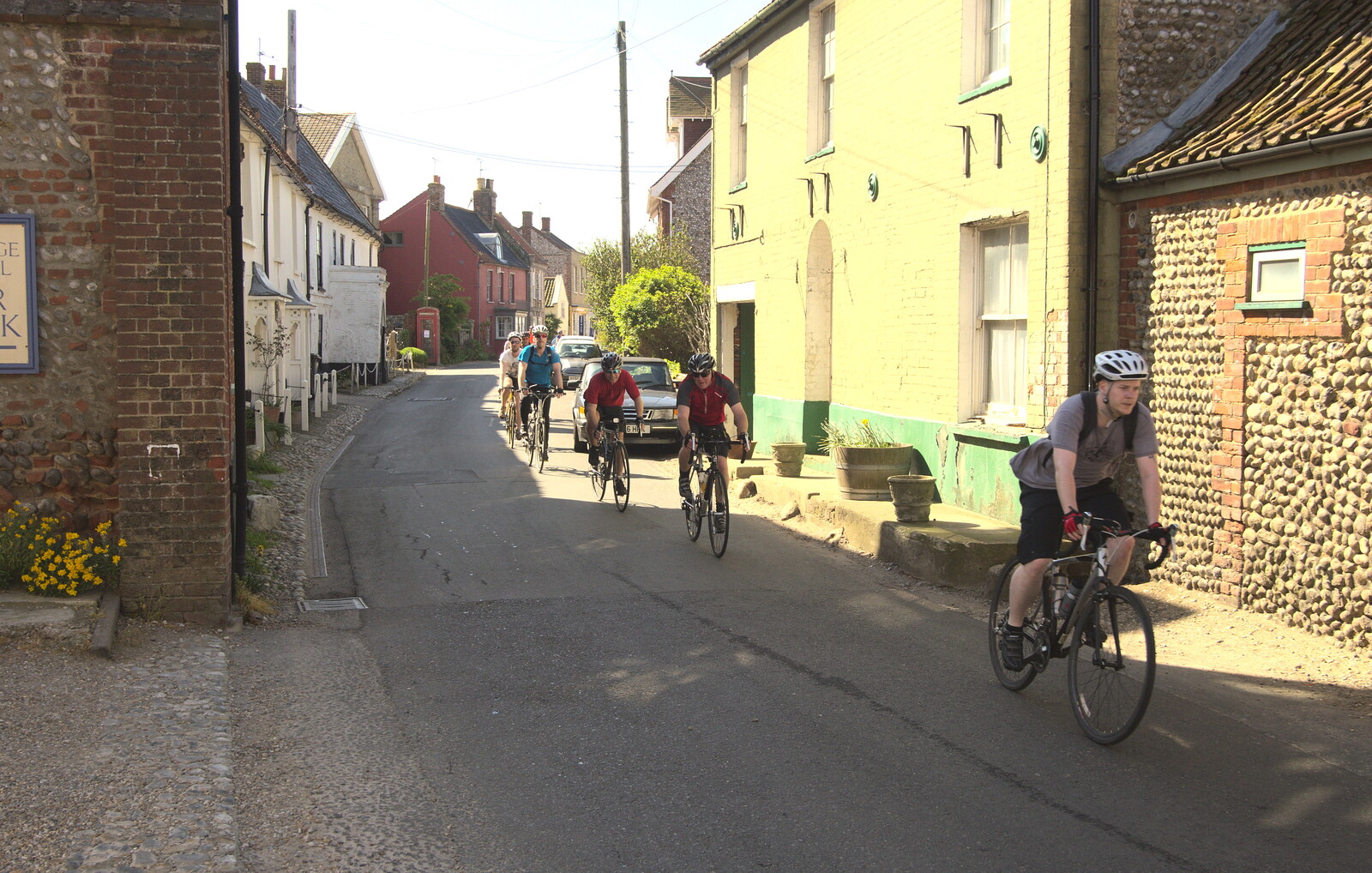 A load of cyclists race through Cley from The BSCC at Needham, and a Birthday By The Sea, Cley, Norfolk - 26th May 2012