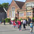 2012 People mill around outside the school