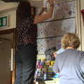 A poster is taken down, A Visit to the Aquarium, The Barbican and Dartmoor, Plymouth, Devon - 10th June 2012