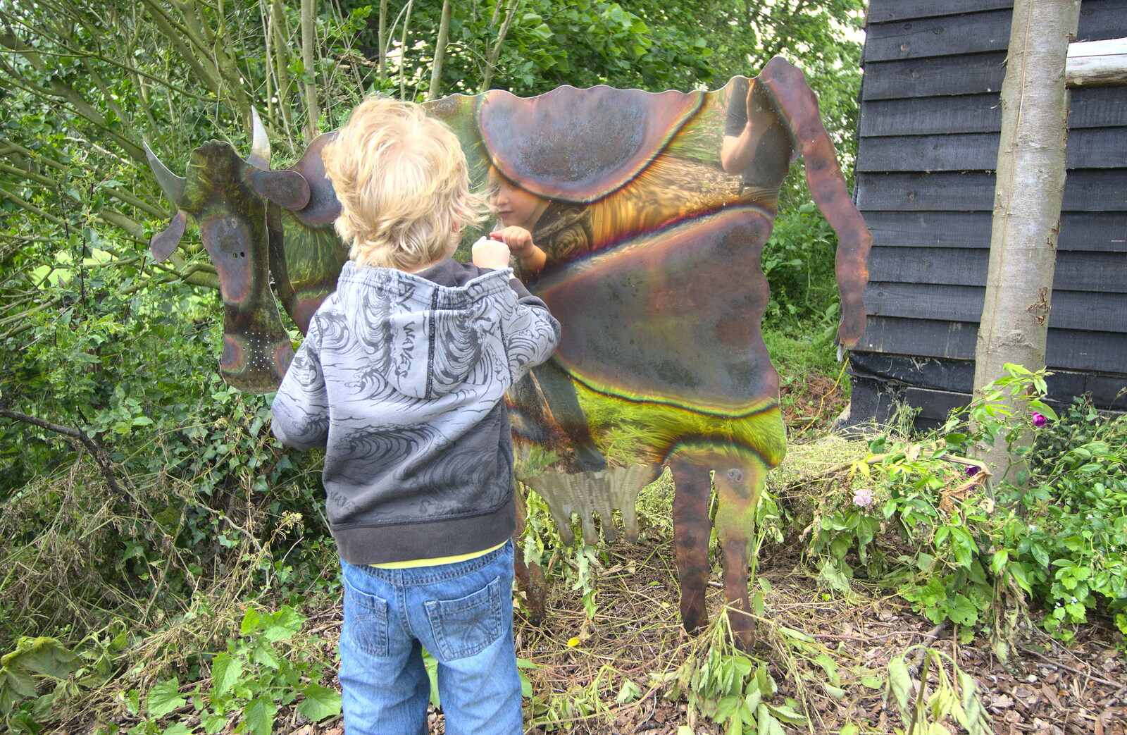 Fred pokes at the cow sculpture from Grandad's Gaff and Music in the Park, Diss, Norfolk - 16th June 2012