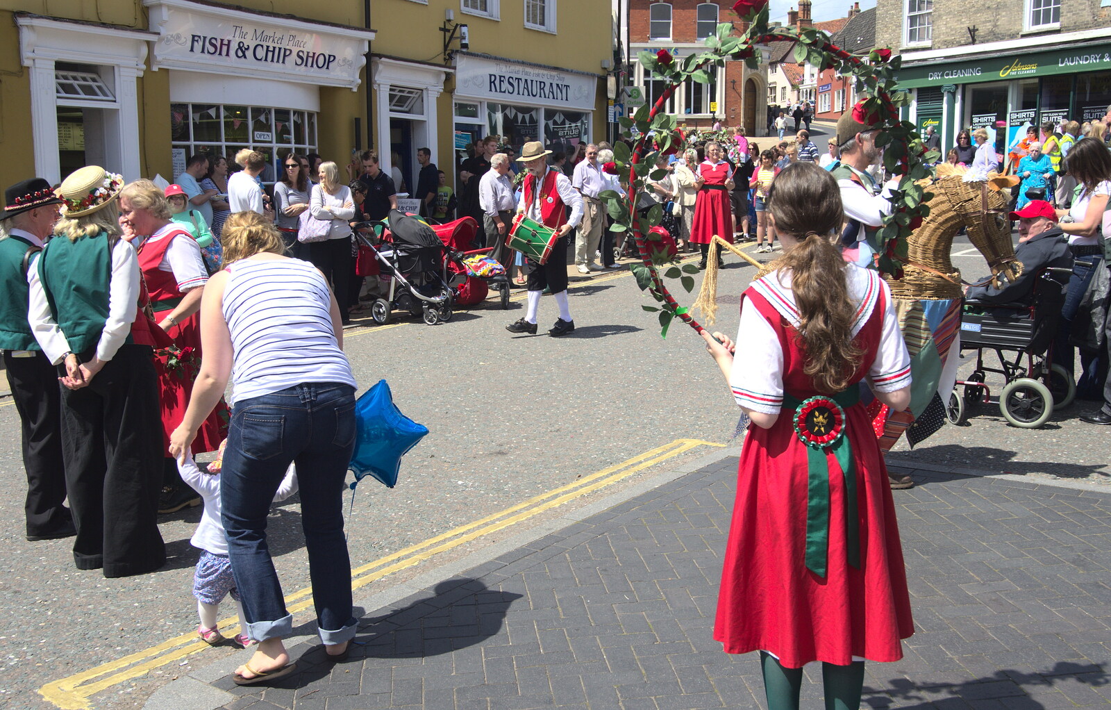 A girl waits with a hoop from Morris Dancing and a Carnival Procession, Diss, Norfolk - 17th June 2012