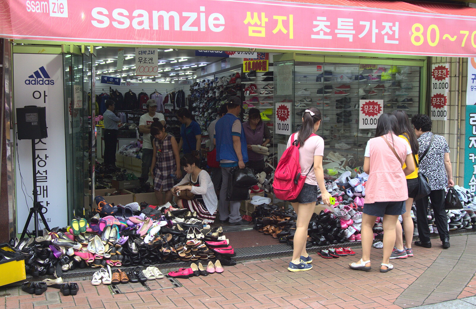 A highly disorganised shoe sale occurs in Daegu from Seomun Market, Daegu, South Korea - 1st July 2012
