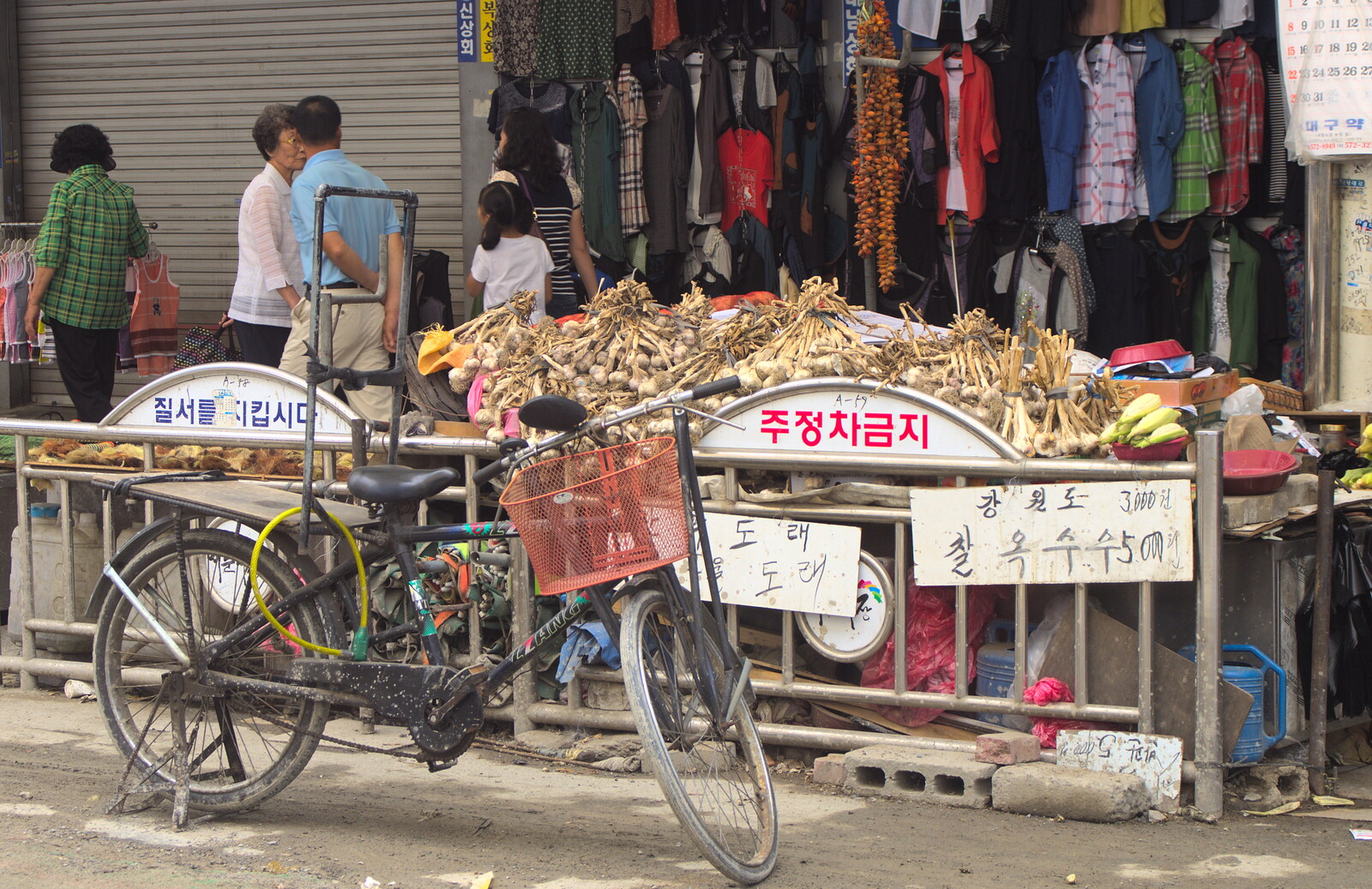 A creaky old bicycle and a pile of garlic from Seomun Market, Daegu, South Korea - 1st July 2012