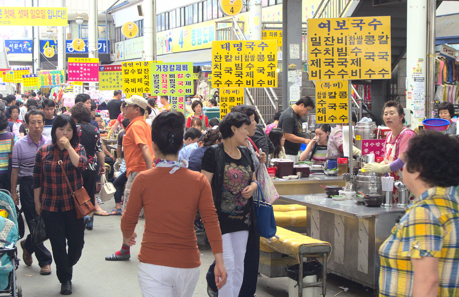 People mill around from Seomun Market, Daegu, South Korea - 1st July 2012