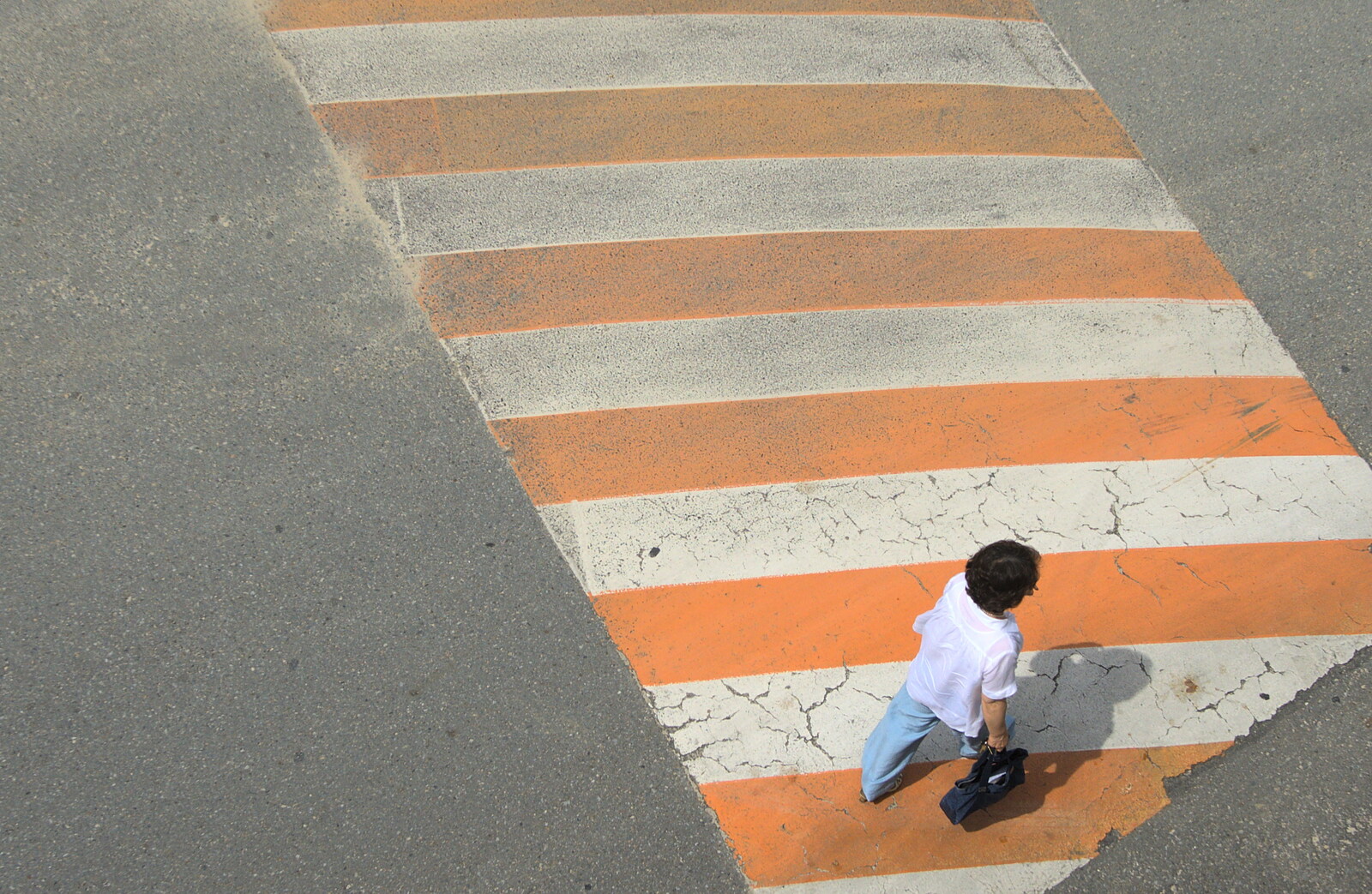 A woman crosses a stripy orange speed bump from Seomun Market, Daegu, South Korea - 1st July 2012