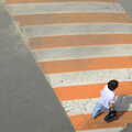 A woman crosses a stripy orange speed bump, Seomun Market, Daegu, South Korea - 1st July 2012