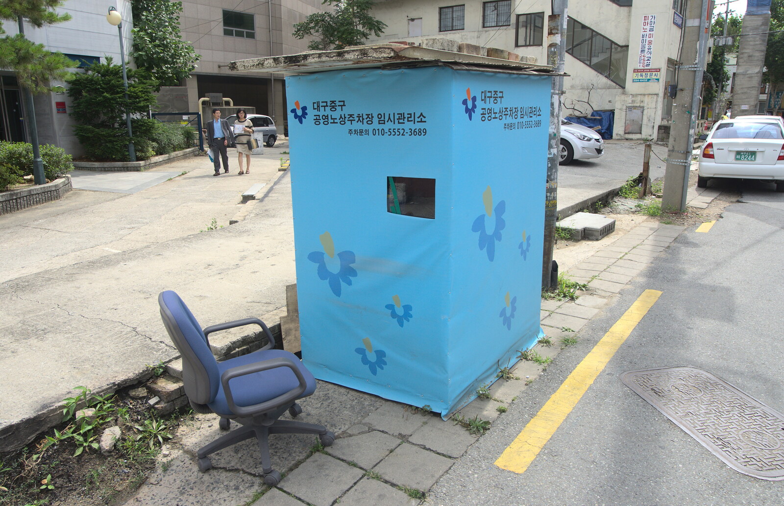 A curious blue hut with a peep-hole in the side from Seomun Market, Daegu, South Korea - 1st July 2012