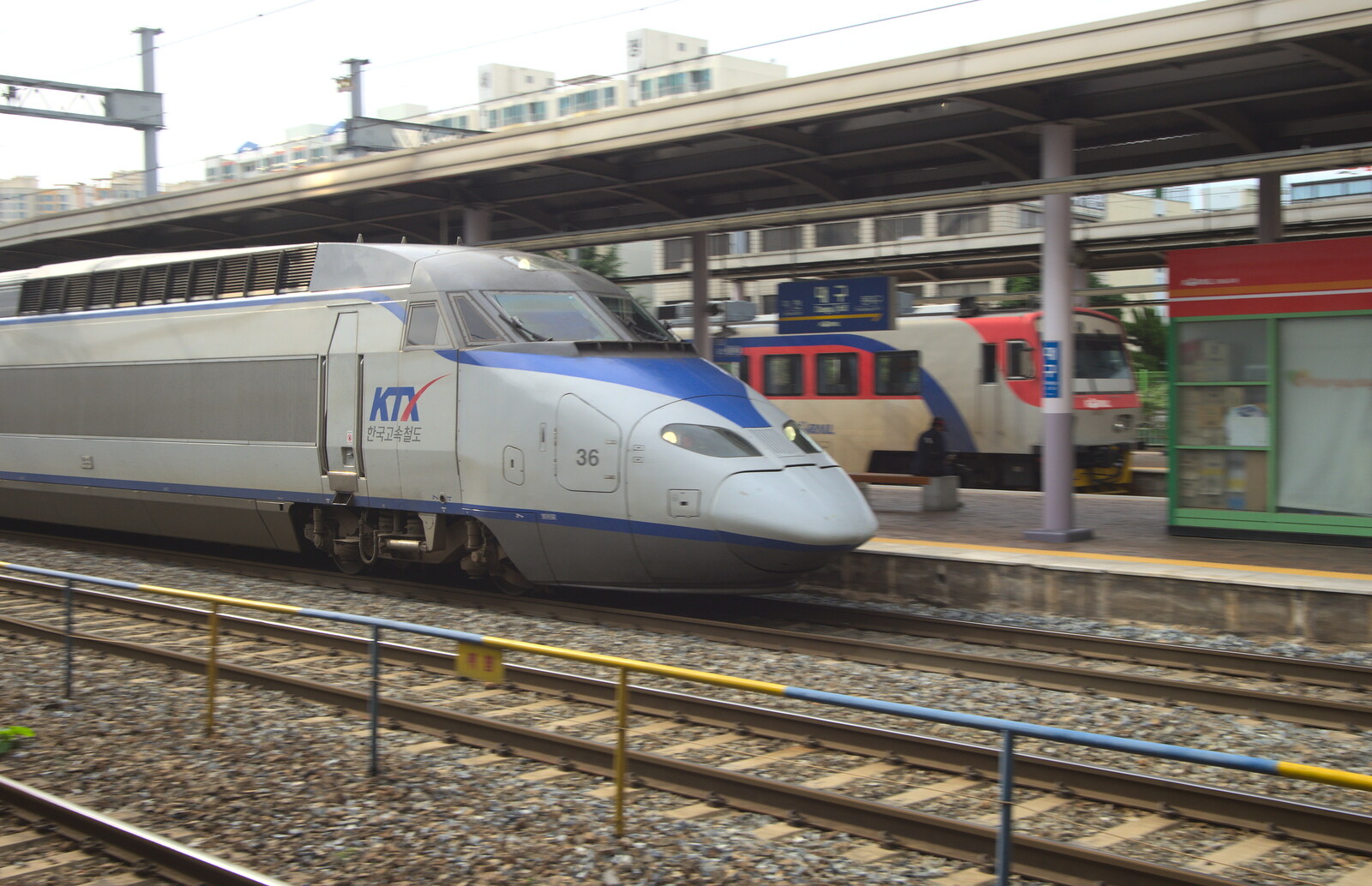 The 16-carriage-long KTX train speeds past  from Seomun Market, Daegu, South Korea - 1st July 2012