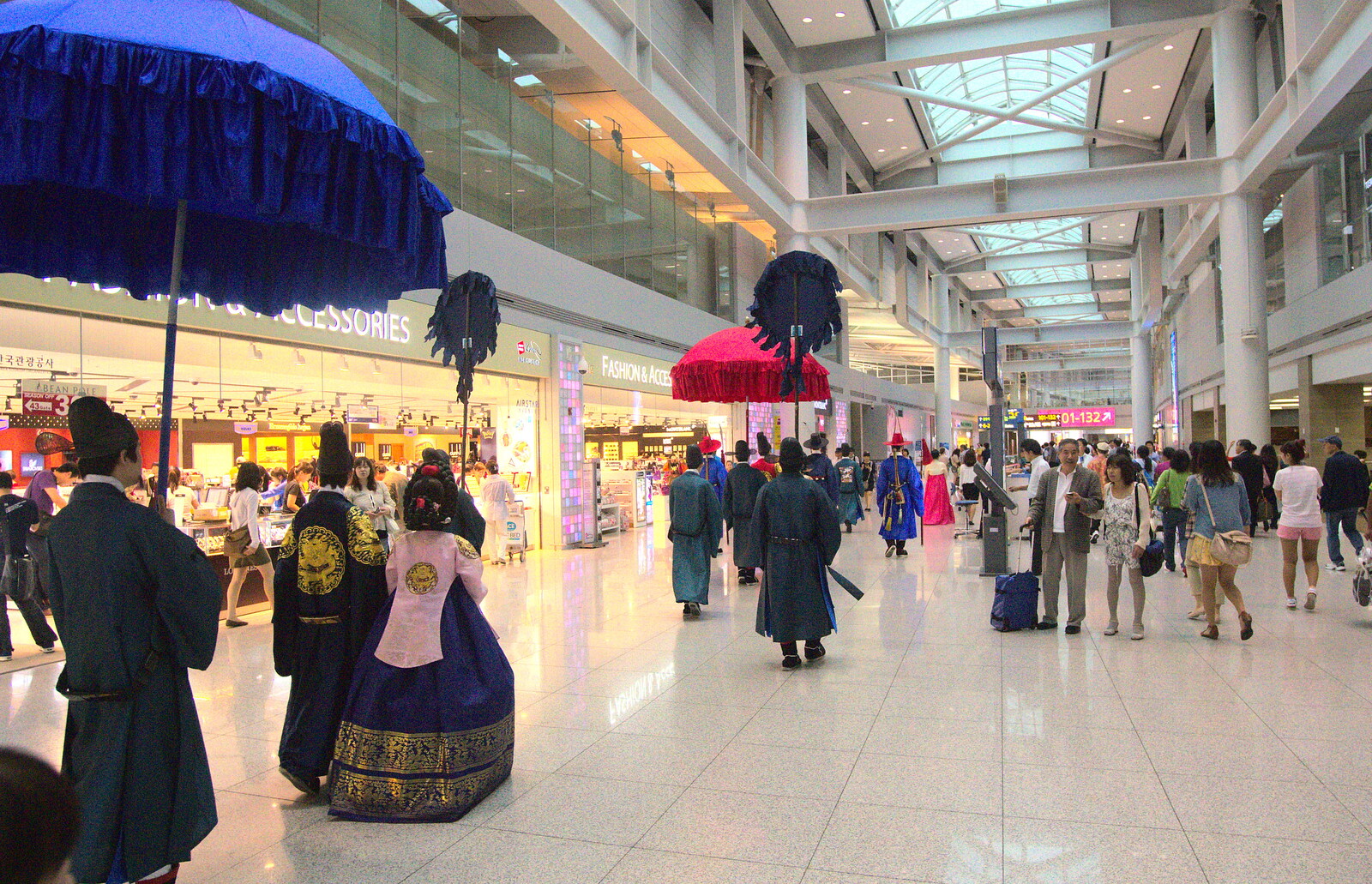 The entourage moves off through the airport from Seomun Market, Daegu, South Korea - 1st July 2012