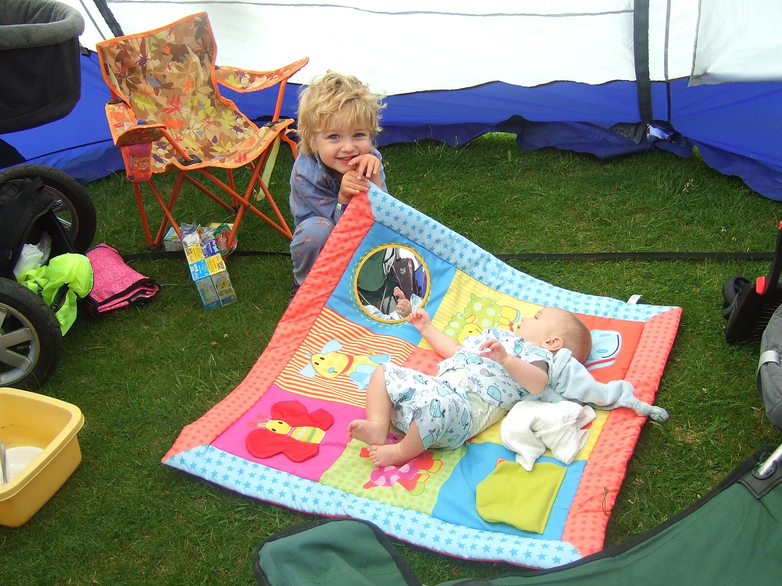 Fred picks the corner of Harry's blanket up from The Cambridge Folk Festival, Cherry Hinton, Cambridge - 28th July 2012