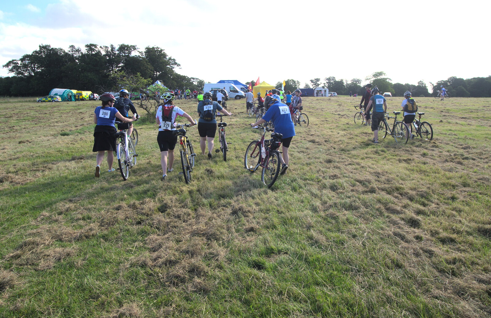 The riders head off across the grass from The RSPB Charity Bike Ride, Little Glemham, Suffolk - 5th August 2012