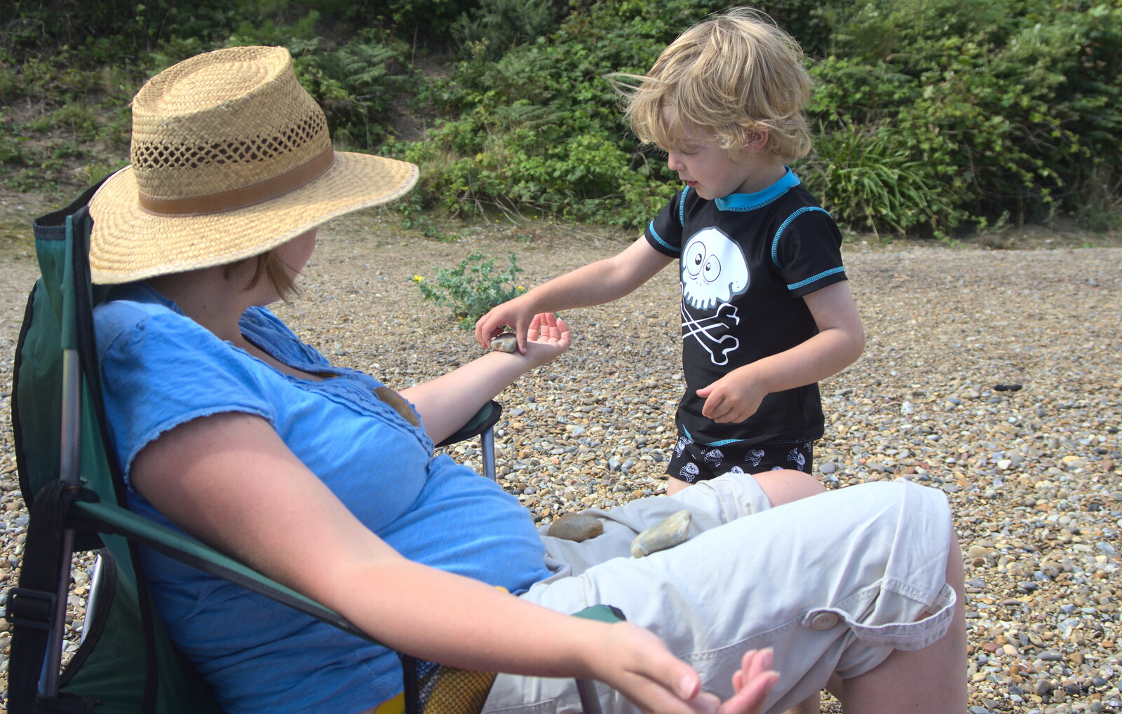 Fred balances a stone on Isobel from Camping by the Seaside, Cliff House, Dunwich, Suffolk - 15th August 2012