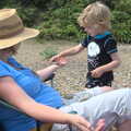 Fred balances a stone on Isobel, Camping by the Seaside, Cliff House, Dunwich, Suffolk - 15th August 2012