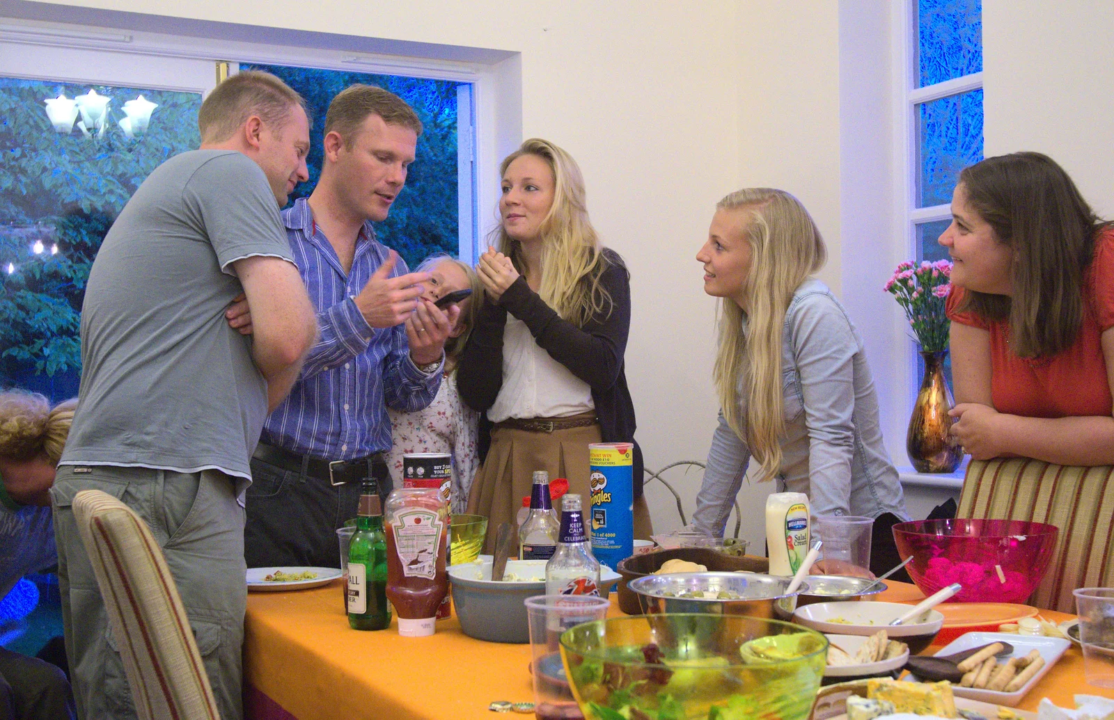 Mike shows something off on his phone, from Bill and Carmen's Paella Barbeque, and a Trip to the City, Yaxley and Norwich - 25th August 2012