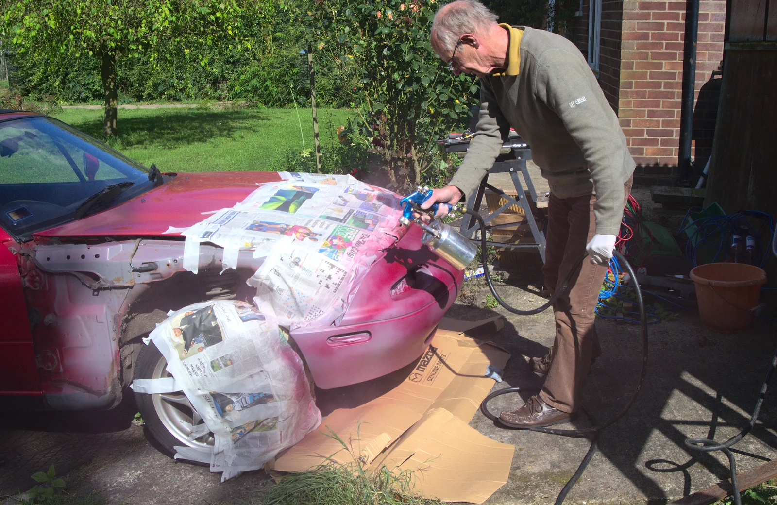 Graham sprays some colour coat, from Camping at Dower House, West Harling, Norfolk - 1st September 2012