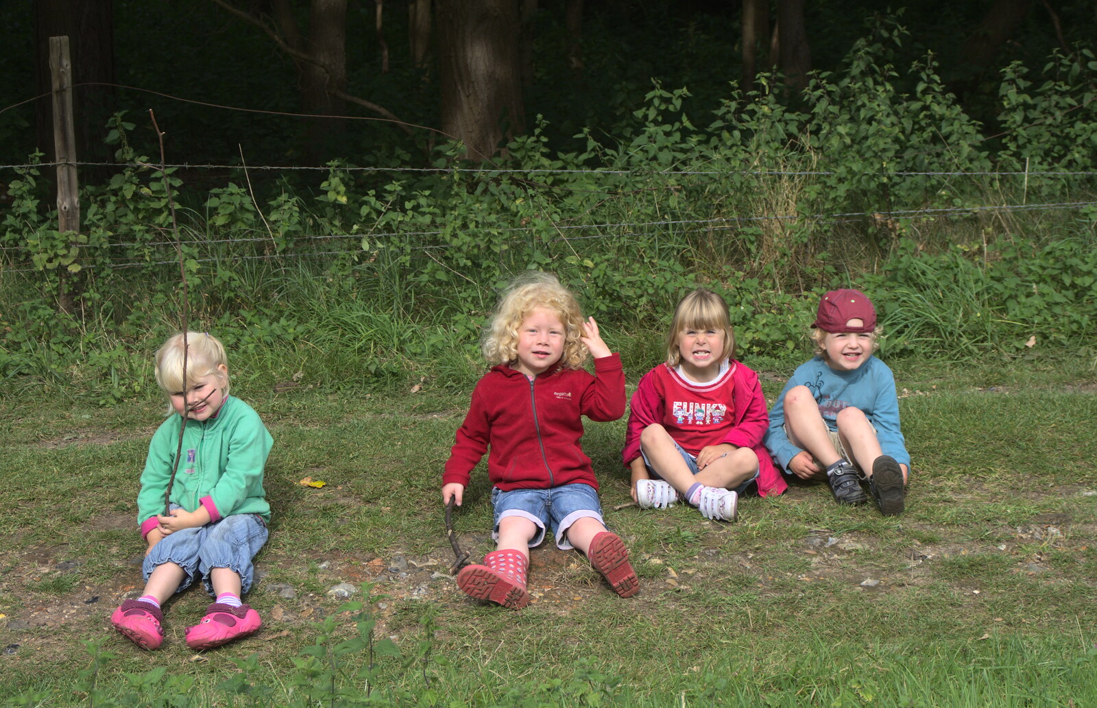 Fred's posse sit down on the grass from Camping at Dower House, West Harling, Norfolk - 1st September 2012