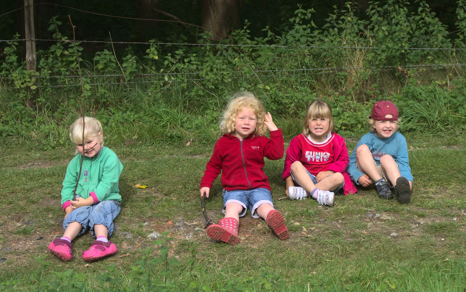 Fred's posse sit down on the grass, from Camping at Dower House, West Harling, Norfolk - 1st September 2012