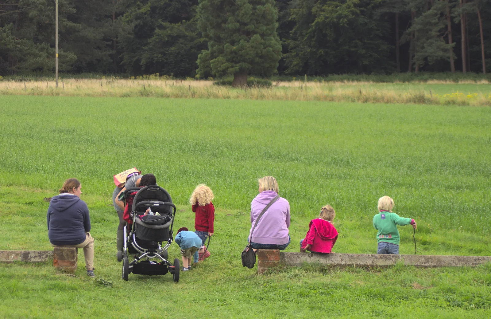 The group sits on a wall and look out, from Camping at Dower House, West Harling, Norfolk - 1st September 2012