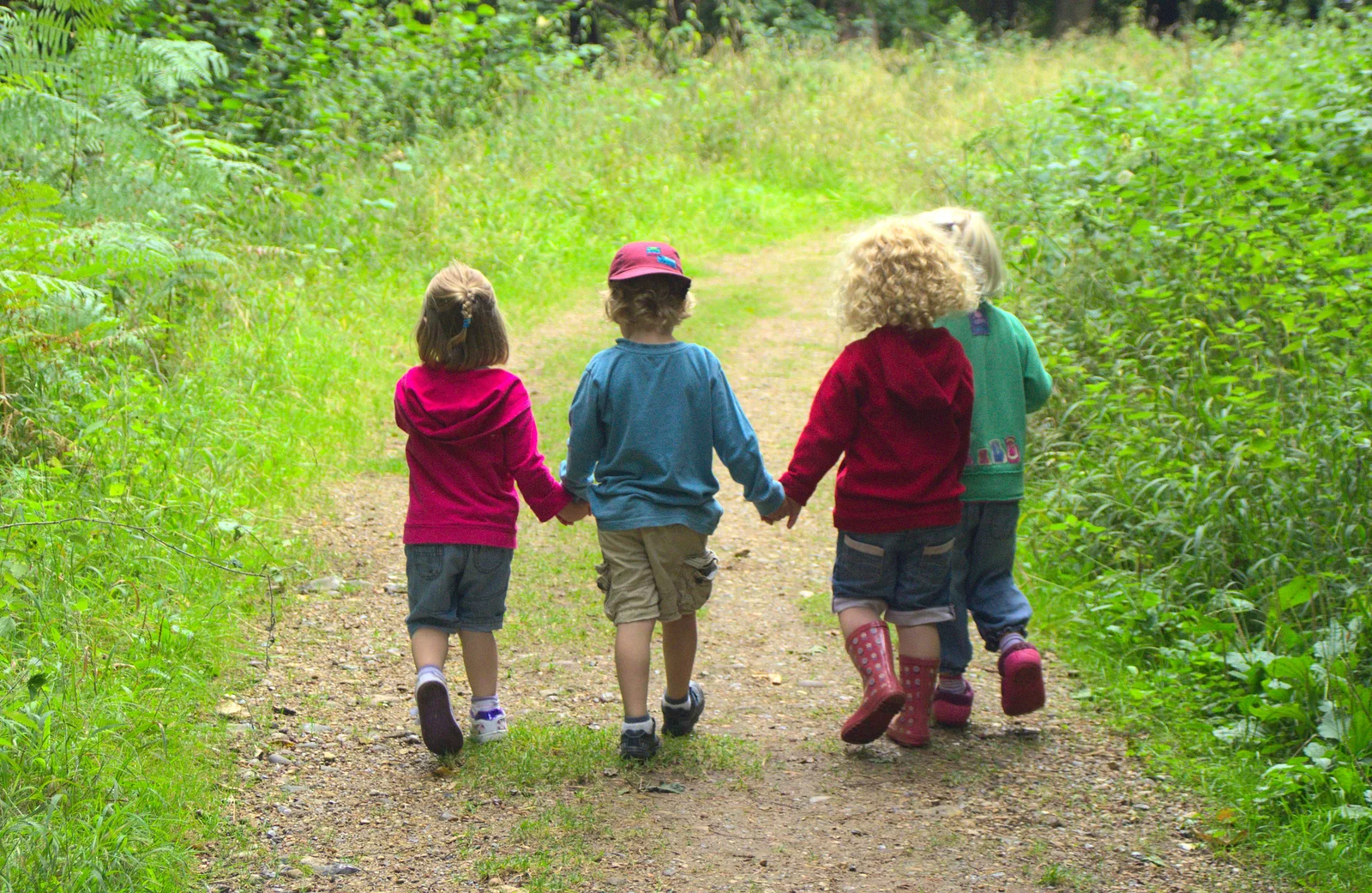 Sophie, Fred, Rosie and Grace walk hand-in-hand, from Camping at Dower House, West Harling, Norfolk - 1st September 2012