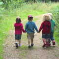 Sophie, Fred, Rosie and Grace walk hand-in-hand, Camping at Dower House, West Harling, Norfolk - 1st September 2012