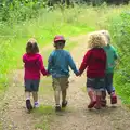 Sophie, Fred, Rosie and Grace walk hand-in-hand, Camping at Dower House, West Harling, Norfolk - 1st September 2012