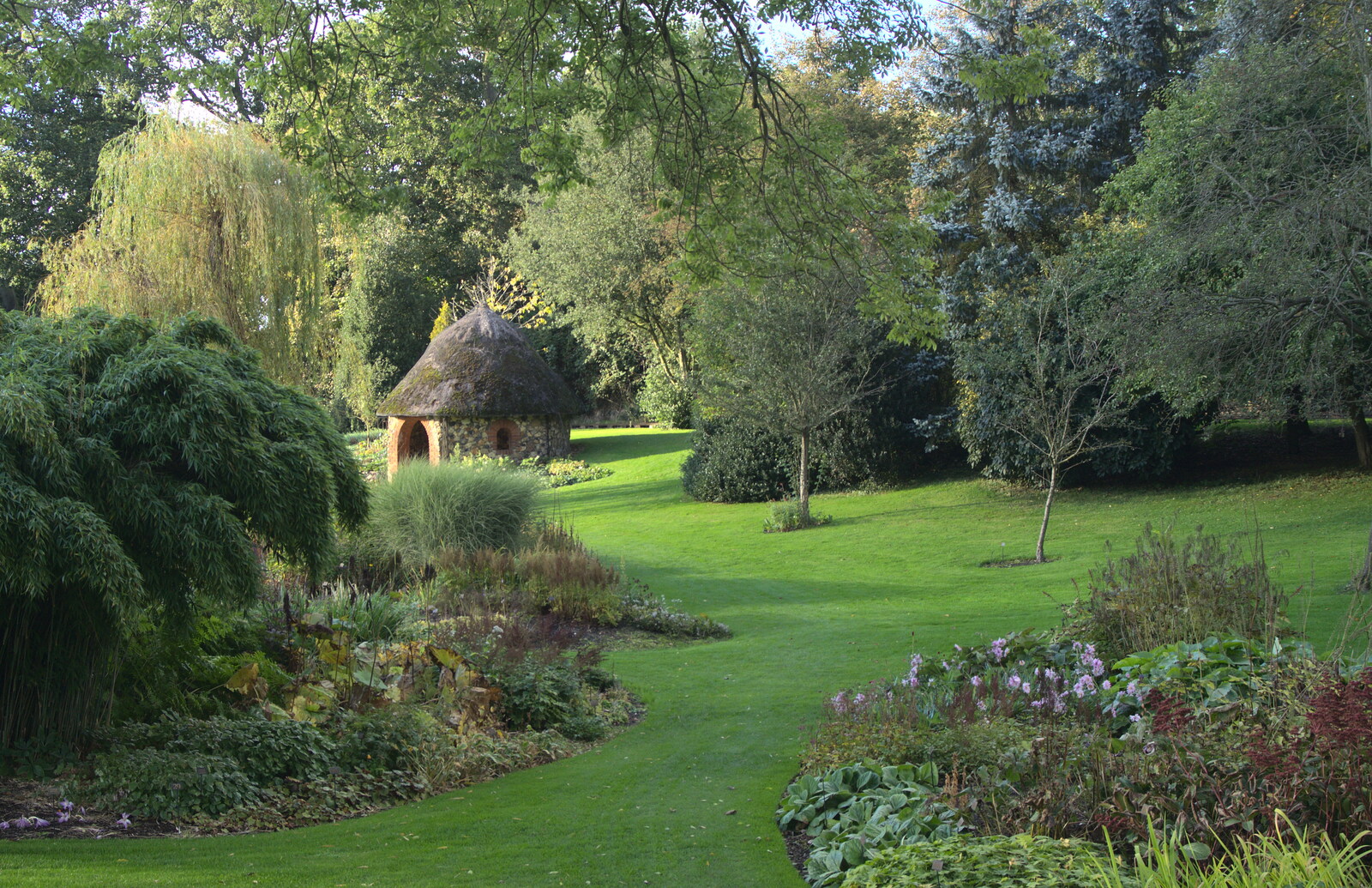 The gardens, and a thatched roundhouse from Alan Bloom's Gardens, Bressingham, Norfolk - 6th October 2012